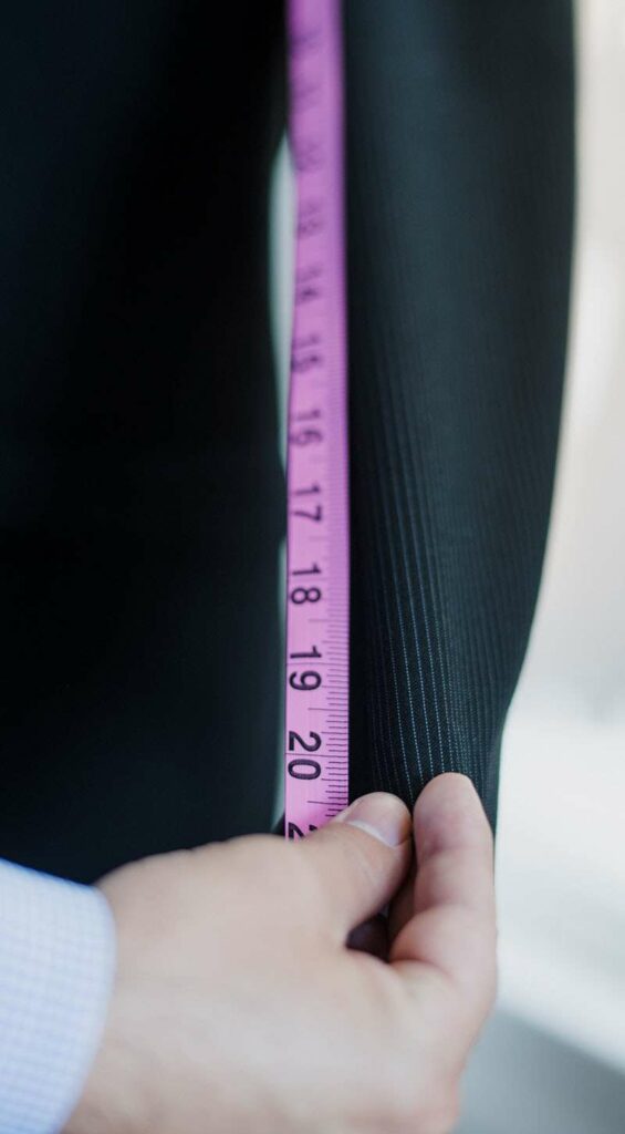 Woman measuring pants to quit dieting